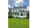Charming two-story home with a front porch and manicured lawn exudes warmth and inviting curb appeal at 1109 Beechwood Dr, Rocky Mount, NC 27803