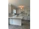 Bright kitchen featuring white cabinets, tile floors, and modern appliances provides a functional cooking space at 1109 Beechwood Dr, Rocky Mount, NC 27803