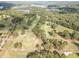 The golf course provides a scenic backdrop for this community, with lush fairways, and lake views in the background at 115 Baystone Dr, Sanford, NC 27332