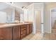 Bathroom features a double sink vanity with ample storage and a separate door to the toilet and shower area at 115 Baystone Dr, Sanford, NC 27332