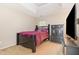 Comfortable bedroom with tray ceilings, a TV and stylish dark furniture at 115 Baystone Dr, Sanford, NC 27332