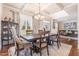 Elegant dining room with coffered ceilings, natural light, and hardwood flooring at 115 Baystone Dr, Sanford, NC 27332