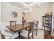 Dining room features a coffered ceiling, chandelier, and wood table at 115 Baystone Dr, Sanford, NC 27332