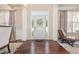 Bright foyer with hardwood floors, white pillars, and natural light at 115 Baystone Dr, Sanford, NC 27332