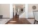 Elegant foyer with hardwood floors, white columns, and a view of the staircase at 115 Baystone Dr, Sanford, NC 27332