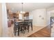 Open kitchen and dining area with stainless appliances and outdoor view at 115 Baystone Dr, Sanford, NC 27332