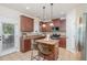 Well-lit kitchen with granite countertops, stainless steel appliances and outdoor access at 115 Baystone Dr, Sanford, NC 27332