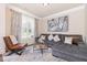 Comfortable living room with a gray sectional sofa and neutral decor at 115 Baystone Dr, Sanford, NC 27332