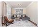Cozy living room with a sectional sofa, area rug, and natural light at 115 Baystone Dr, Sanford, NC 27332