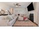 Comfortable living room with fireplace, stairway, and a decorative mirror at 115 Baystone Dr, Sanford, NC 27332