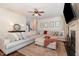 Cozy living room with fireplace, soft sofa, and decorative artwork at 115 Baystone Dr, Sanford, NC 27332