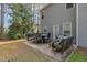 Spacious patio featuring comfortable seating and a dining area, ideal for outdoor relaxation and gatherings at 115 Baystone Dr, Sanford, NC 27332