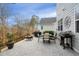Spacious backyard patio featuring a fire pit, grill, and outdoor seating area at 1213 Remey Ave, Wake Forest, NC 27587