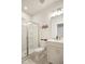 Bright bathroom features a tiled shower with glass doors and a white vanity at 1213 Remey Ave, Wake Forest, NC 27587