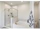 This bathroom features a glass-doored shower and a luxurious soaking tub at 1213 Remey Ave, Wake Forest, NC 27587
