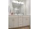 This bathroom features a vanity, double sink and bright lighting at 1213 Remey Ave, Wake Forest, NC 27587