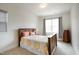 This bedroom features simple decor and a window for natural lighting at 1213 Remey Ave, Wake Forest, NC 27587