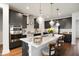 Modern kitchen featuring a large center island, stainless steel appliances, and stylish pendant lighting at 1213 Remey Ave, Wake Forest, NC 27587