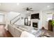 Open-concept living room with a fireplace, hardwood floors, and plenty of space for entertaining at 1213 Remey Ave, Wake Forest, NC 27587