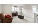 Bright, neutral living room with a brown leather recliner and modern furnishings at 1213 Remey Ave, Wake Forest, NC 27587