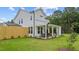 Spacious backyard with a covered patio perfect for outdoor dining and entertaining at 134 Favored Avenue, Sanford, NC 27330