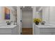 This bathroom has double sinks with white quartz countertops, black hardware, and access to the walk-in closet at 134 Favored Avenue, Sanford, NC 27330
