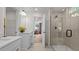 This primary bathroom has double sinks, walk-in closet, and glass enclosed shower with a built-in bench at 134 Favored Avenue, Sanford, NC 27330