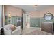 Bedroom view of wainscoting, neutral walls, blanket ladder, and a peek into another room at 134 Favored Avenue, Sanford, NC 27330