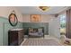Bedroom with wainscoting, neutral walls, and an equestrian themed painting at 134 Favored Avenue, Sanford, NC 27330