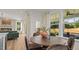 Breakfast nook featuring a round table set, backyard view, and easy access to the kitchen and living room at 134 Favored Avenue, Sanford, NC 27330