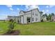 Beautifully landscaped backyard with a covered patio and well-maintained lawn at 134 Favored Avenue, Sanford, NC 27330