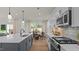 Kitchen featuring pendant lighting over island with white countertops, stainless appliances, and breakfast nook at 134 Favored Avenue, Sanford, NC 27330