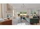 Sunlit living room with a fireplace, large windows, plush seating, and access to an outdoor patio at 134 Favored Avenue, Sanford, NC 27330