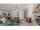 Spacious living room featuring hardwood floors, a fireplace, and an open flow to the kitchen at 134 Favored Avenue, Sanford, NC 27330