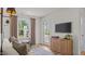 Cozy living room with contemporary decor, natural light, and access to the outdoors at 134 Favored Avenue, Sanford, NC 27330