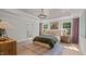 Bedroom featuring tray ceilings, hardwood floors, neutral walls and an area rug at 134 Favored Avenue, Sanford, NC 27330