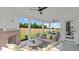 Relax in the shade of this covered patio complete with an outdoor fireplace and ceiling fans at 134 Favored Avenue, Sanford, NC 27330