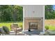 This covered patio is complete with an outdoor fireplace with a brick surround perfect for enjoying the outdoors at 134 Favored Avenue, Sanford, NC 27330