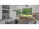 The covered patio is complete with an outdoor seating area, ceiling fan and views of the spacious backyard at 134 Favored Avenue, Sanford, NC 27330