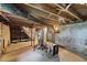 Unfinished basement featuring the home's mechanics and access to the home's upper floors at 201 N Us 301, Micro, NC 27555