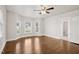 Bright bedroom with bay windows, hardwood flooring, ceiling fan and en-suite bathroom at 201 N Us 301, Micro, NC 27555