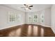 Spacious bedroom with bay window and hardwood flooring, with ceiling fan installed at 201 N Us 301, Micro, NC 27555