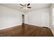 Spacious bedroom with hardwood floors, a ceiling fan, and white trim at 201 N Us 301, Micro, NC 27555