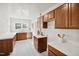 Bright kitchen with light wood cabinets, white countertops, and ample natural light at 201 N Us 301, Micro, NC 27555