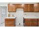 Kitchen featuring wooden cabinets, white countertops, and stylish decor at 201 N Us 301, Micro, NC 27555