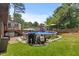 Backyard featuring a pool and landscaped garden, perfect for outdoor enjoyment and relaxation at 2020 Port Royal Rd, Raleigh, NC 27609