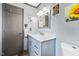 Updated bathroom with a marble vanity, modern lighting, and neutral paint at 2020 Port Royal Rd, Raleigh, NC 27609