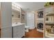 Well-lit bathroom features a shower, sink, vanity, and washer/dryer at 2020 Port Royal Rd, Raleigh, NC 27609