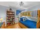 bedroom with bunkbeds, hardwood floors, and a bookcase at 2020 Port Royal Rd, Raleigh, NC 27609