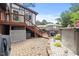 Home exterior showcasing a back deck, brick patio, and above-ground pool, ideal for summer relaxation and entertainment at 2020 Port Royal Rd, Raleigh, NC 27609